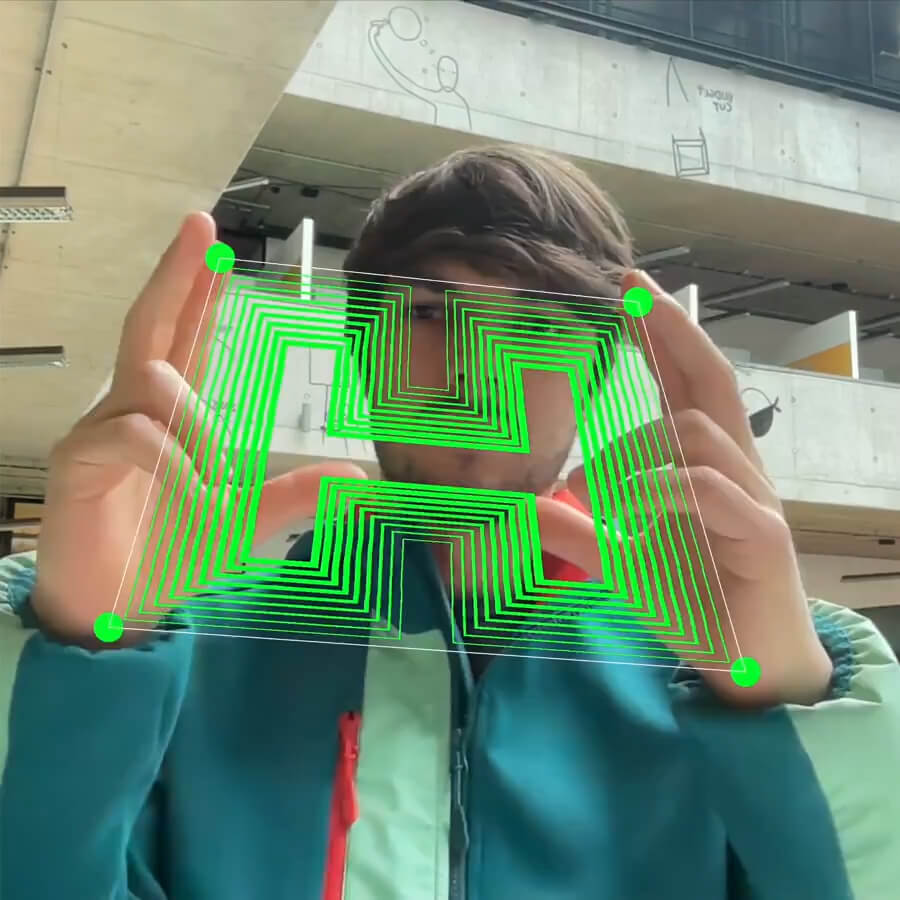 My hands get detected with motion tracking and between them I stretch and rotate the letter H.