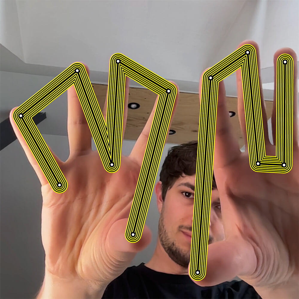 The letters M and N are drawn with multiple contours between the fingers of my hands. The lettes follow the movement of my fingers.