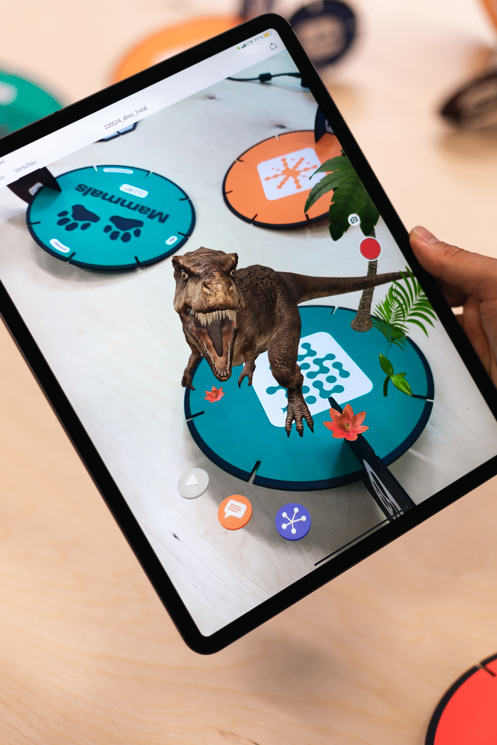 Augmented reality prototype of cardboard modules launching 3D dinausoaurs.