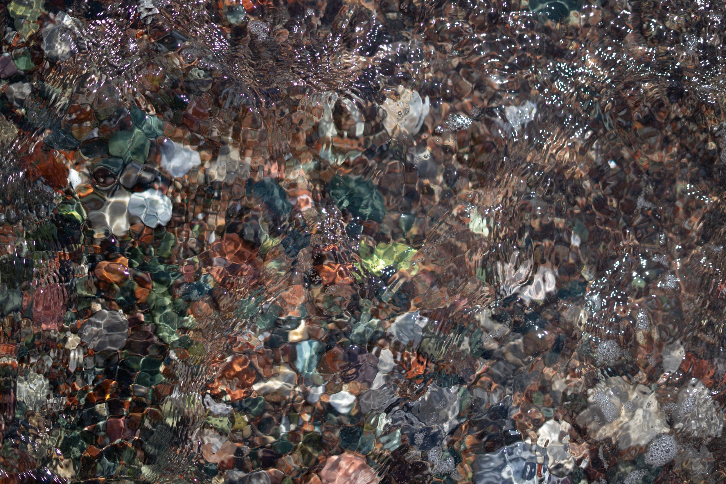 Stones underneath the water surface.